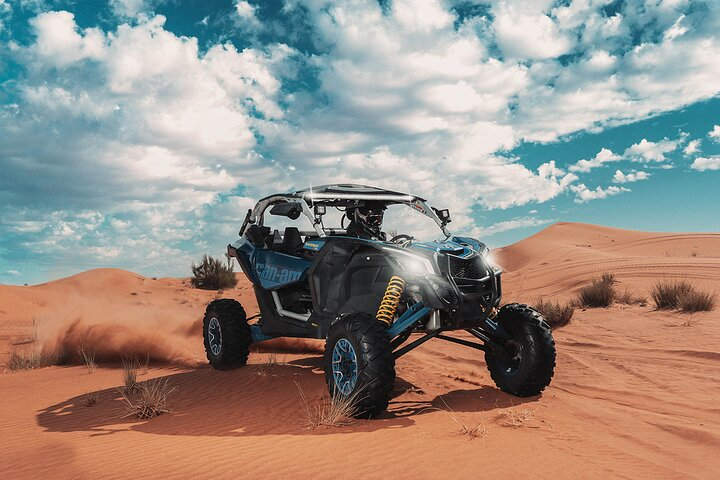 Experience the vast desert landscape from behind the wheel of the Can-am Maverick X3 RR Turbo. Feel the excitement as you navigate stunning sand dunes with a friend.